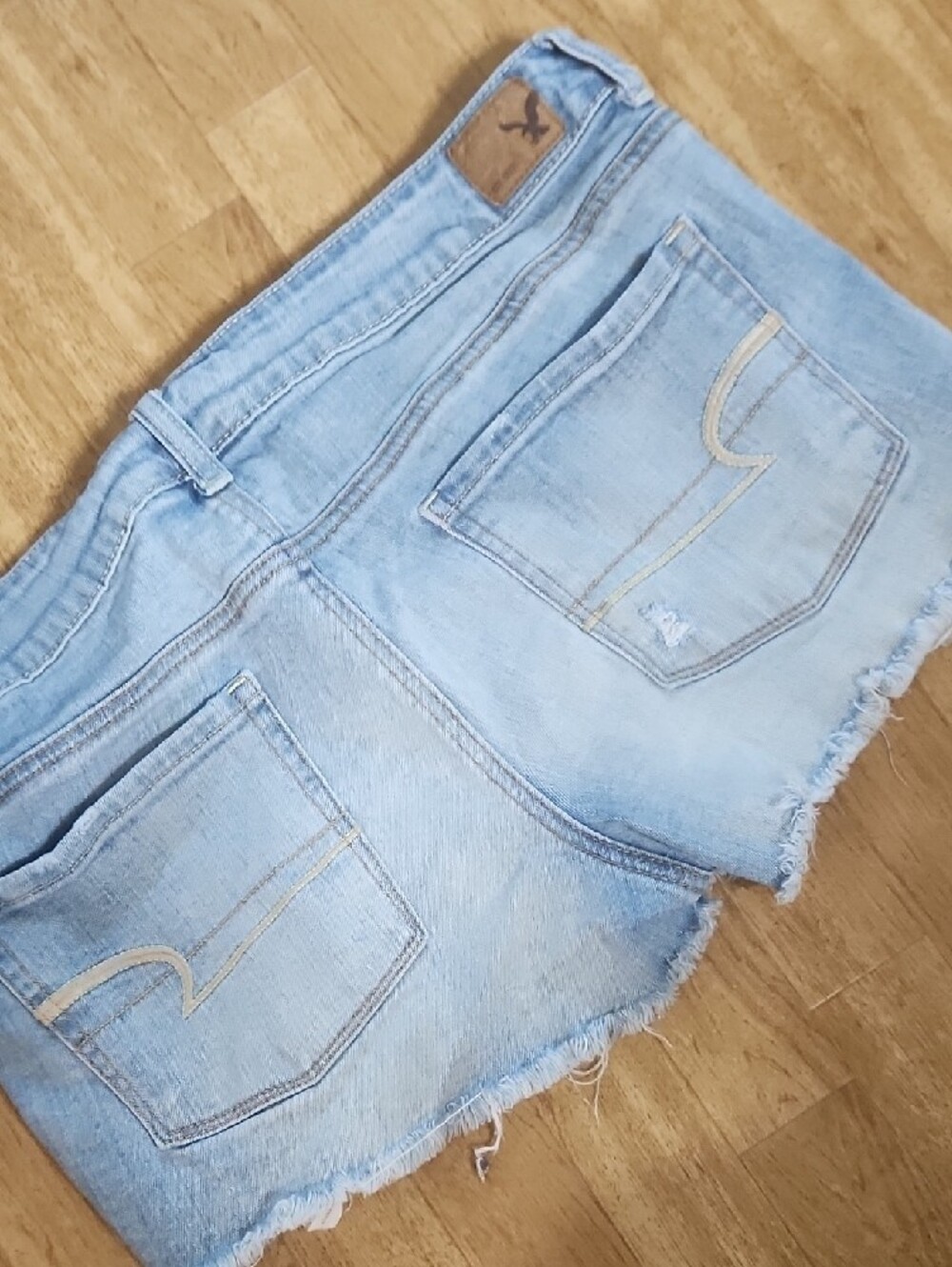 American Eagle Outfitters Light Blue Distressed Denim Shorts with Lace Hem - Picture 4 of 5